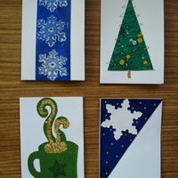 Holiday Gift Tags B: Blue snowflakes on blue background; minimalist christmast tree; green mug with golden steam; white snowflake on diagonal blue field.