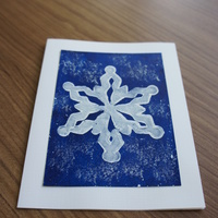 Snowflake Blue: White snowflake on snowy blue field.